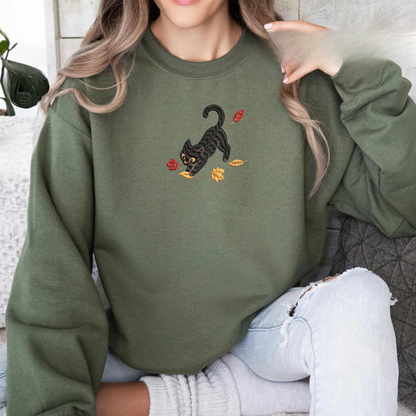 Black Cat Pouncing Autumn Leaves Sweater