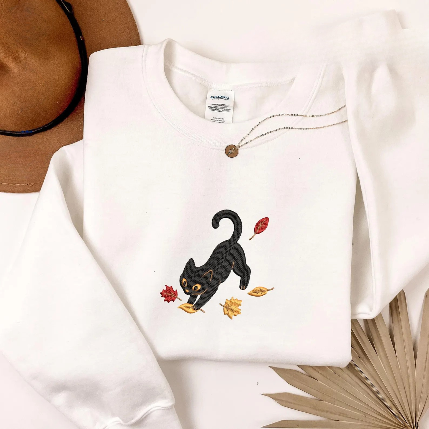 Black Cat Pouncing Autumn Leaves Sweater