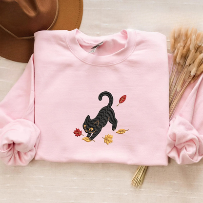 Black Cat Pouncing Autumn Leaves Sweater