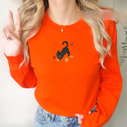 Black Cat Pouncing Autumn Leaves Sweater