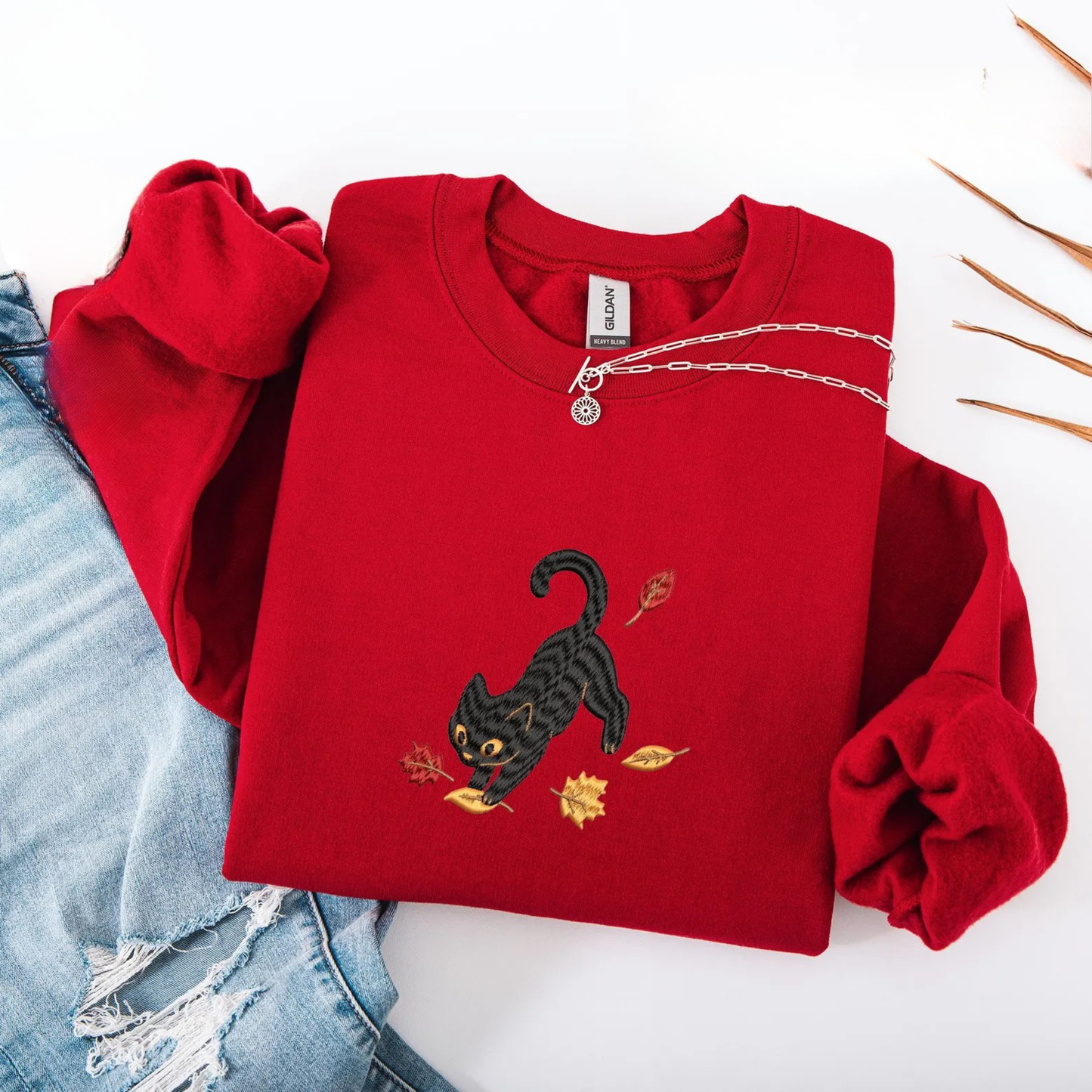 Black Cat Pouncing Autumn Leaves Sweater