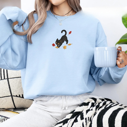 Black Cat Pouncing Autumn Leaves Sweater